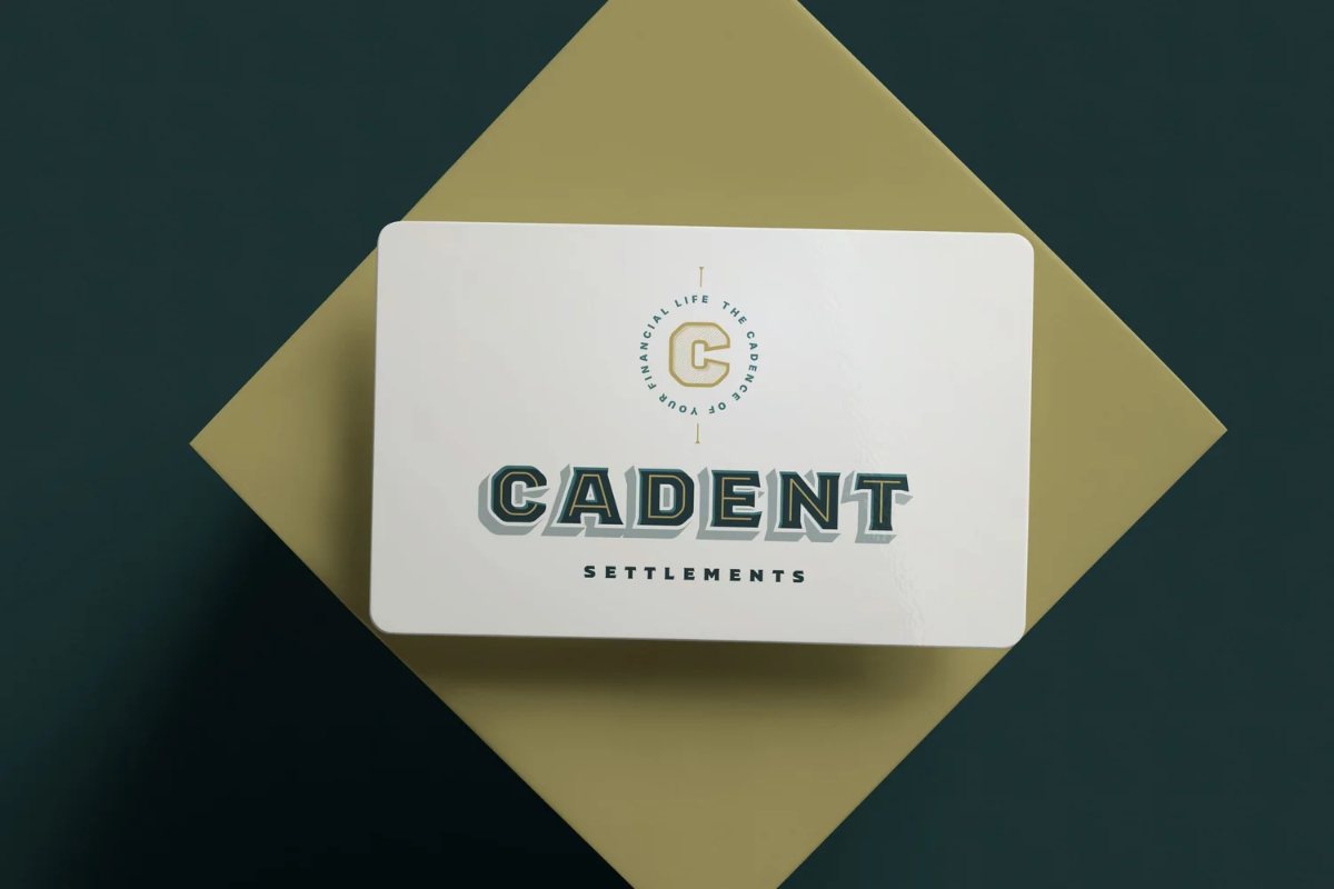 Cadent Settlements card on a gold square