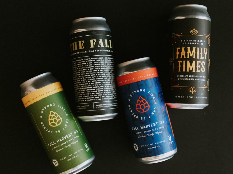 Four craft beer cans including Fall Harvest IPA