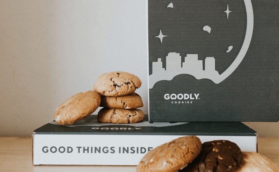 Goodly cookie box with cookies on a table