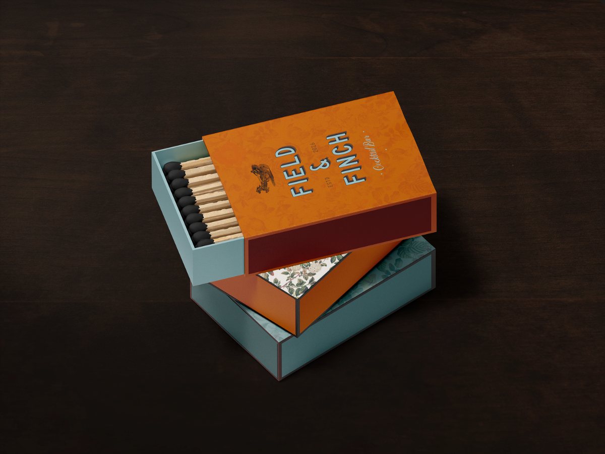 Field and Finch matchbox packaging in orange and teal