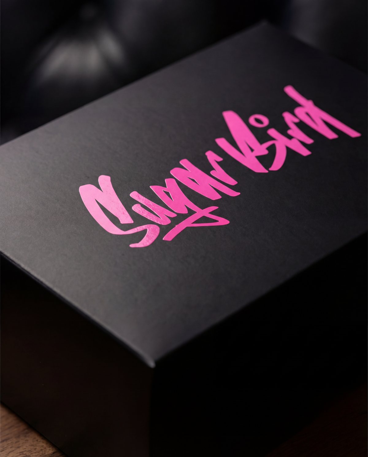 Black box with pink Sugarbird script